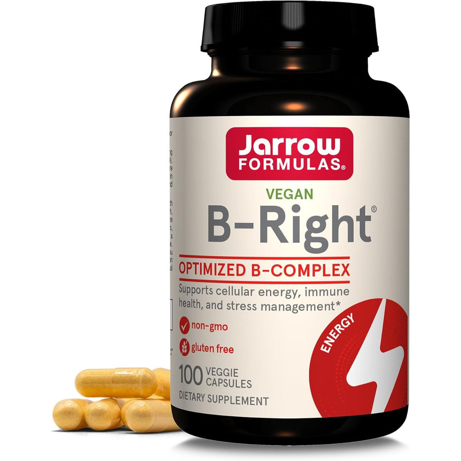 Recipient plastic negru Jarrow  B-Right cu capac negru, logo roșu-verde, text Vegan, titlu mare B-Right, banner roșu Optimized B-Complex, icoane non-GMO și gluten free, badge Energy roșu cu fulger, 100 Veggie Capsules, capsule galbene vizibile alături. Complex B premium vegan cu forme metilate active: metil B12, metil folat 5-MTHF, vitamina B6 P-5-P, pantethină, colină și inozitol pentru biodisponibilitate superioară. Susține energia celulară, sănătatea neurologică și gestionarea stresului.